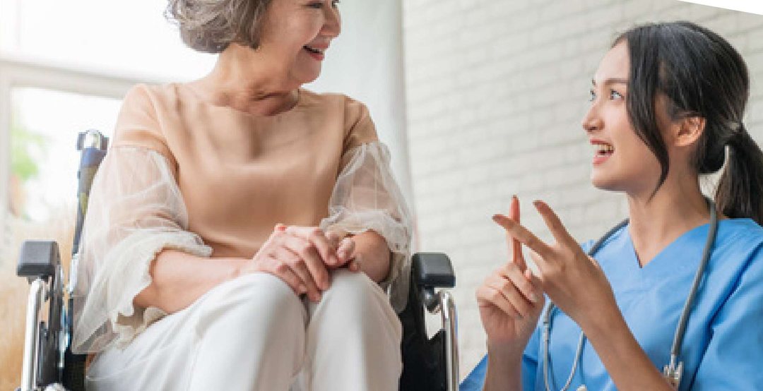 A caregiver in conversation with an older client