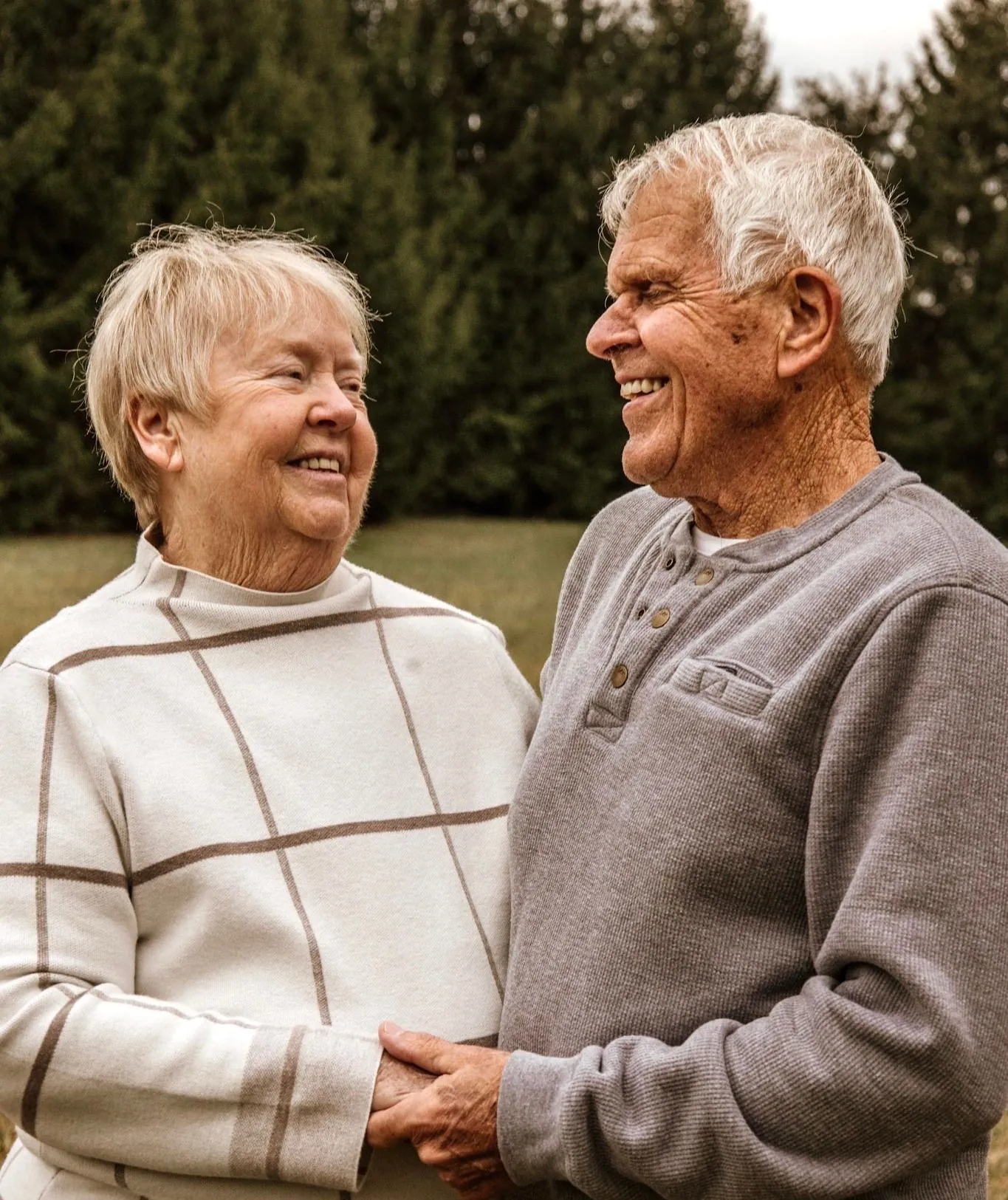 Wendy and Jack Sparks, smiling at each other outdoors